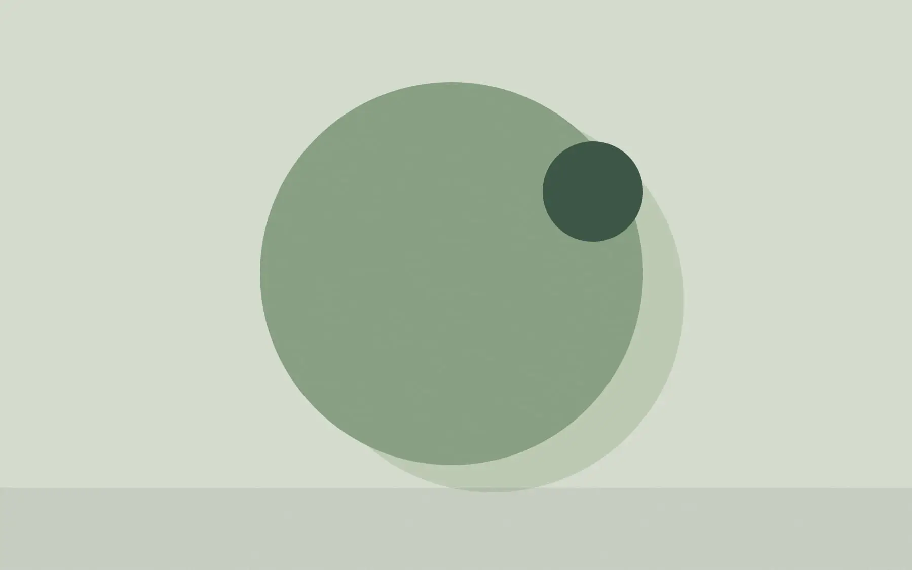 Two overlapping circles in sage green and dark forest green with a small pale circle at the centre of the overlap.
